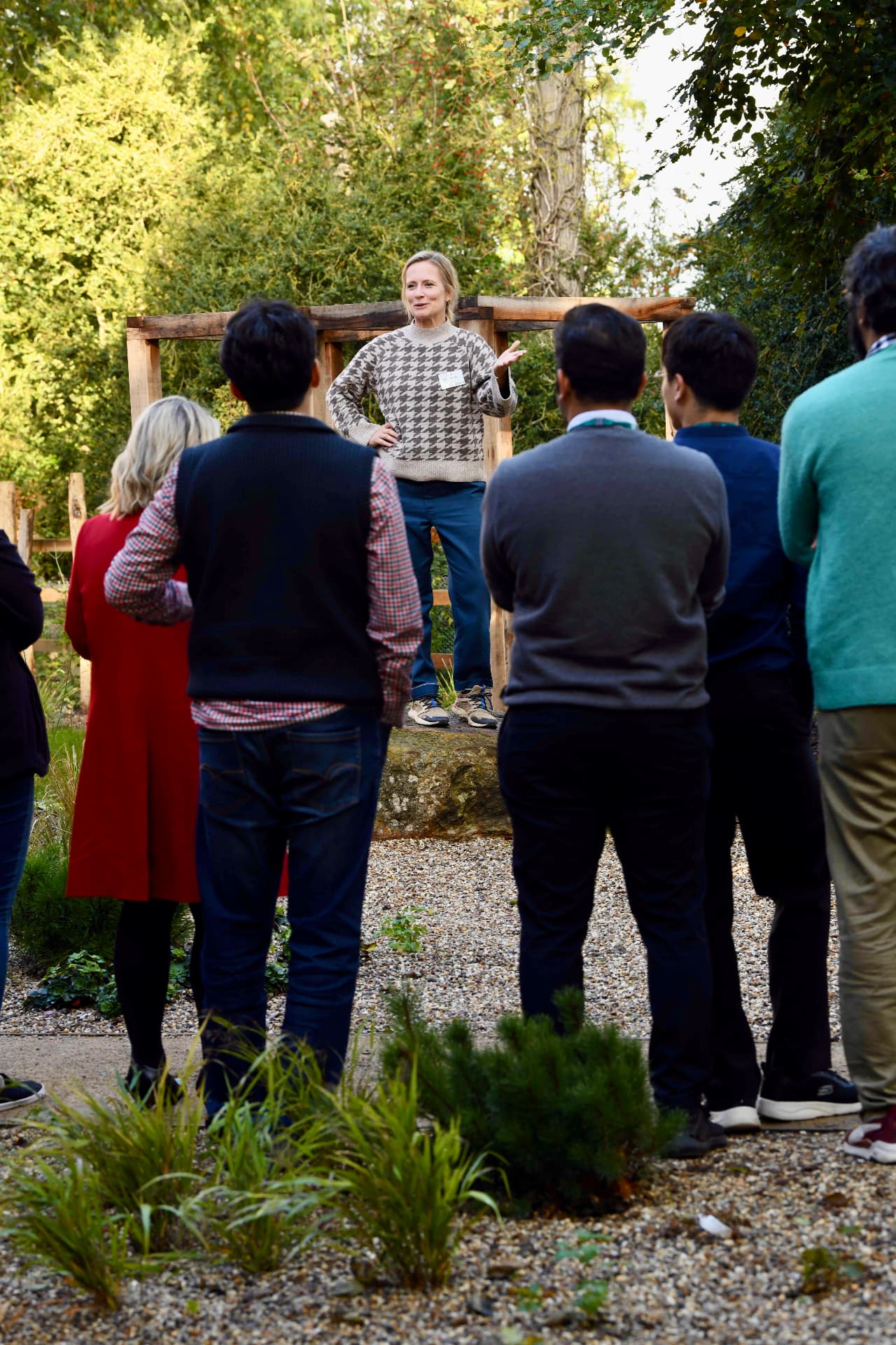Mia Niklasson teaching a group outdoors in a garden