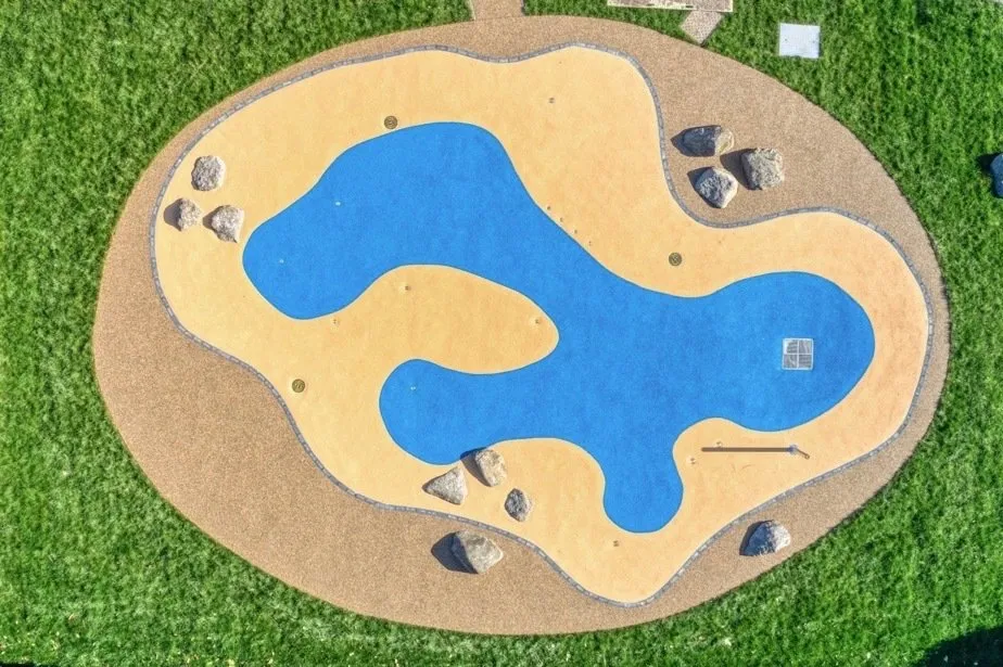 Blue and ochre water-play landscape at Newmarket Memorial Gardens