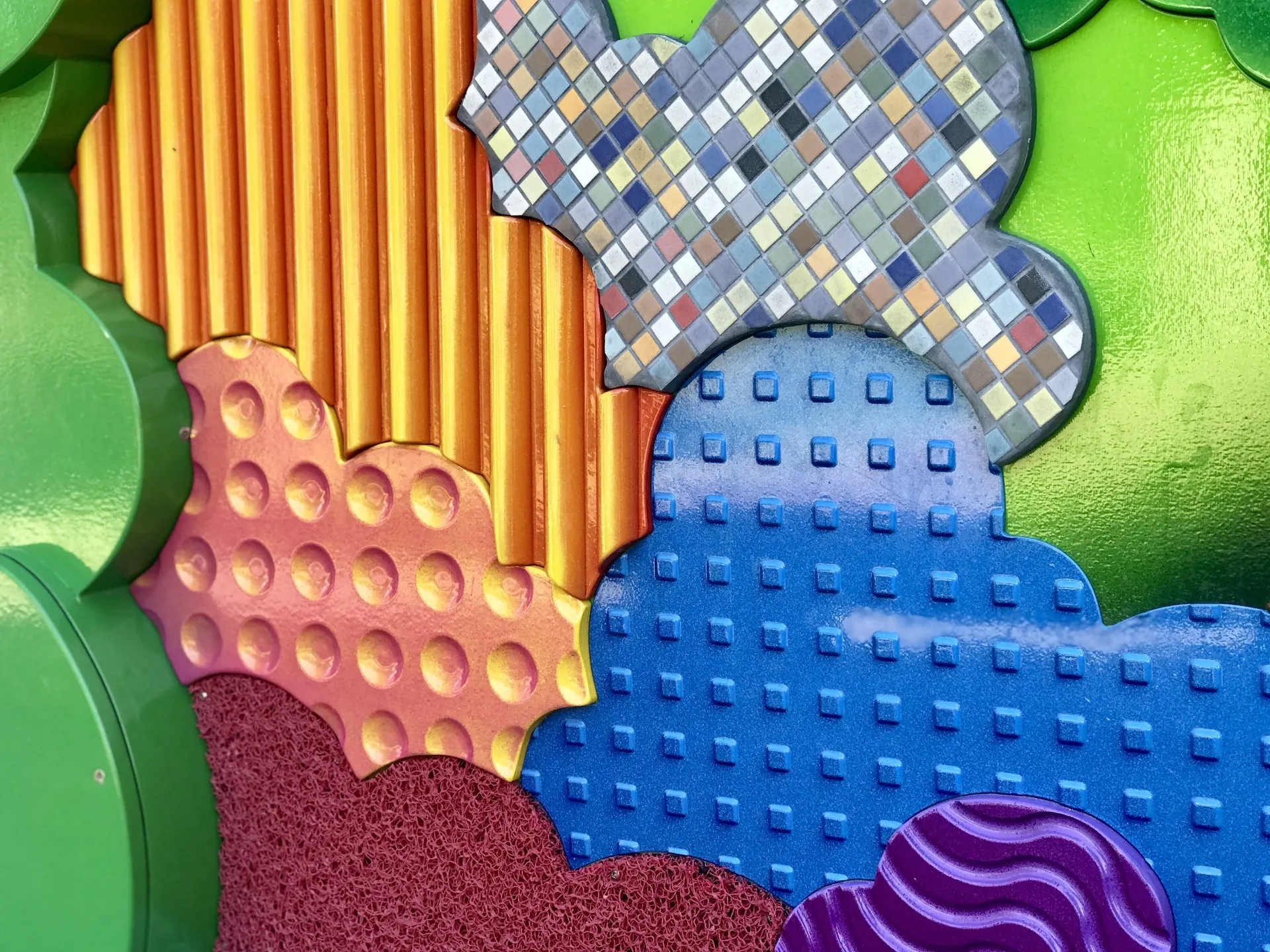 Colourful tactile sensory play panels with varied surfaces and patterns