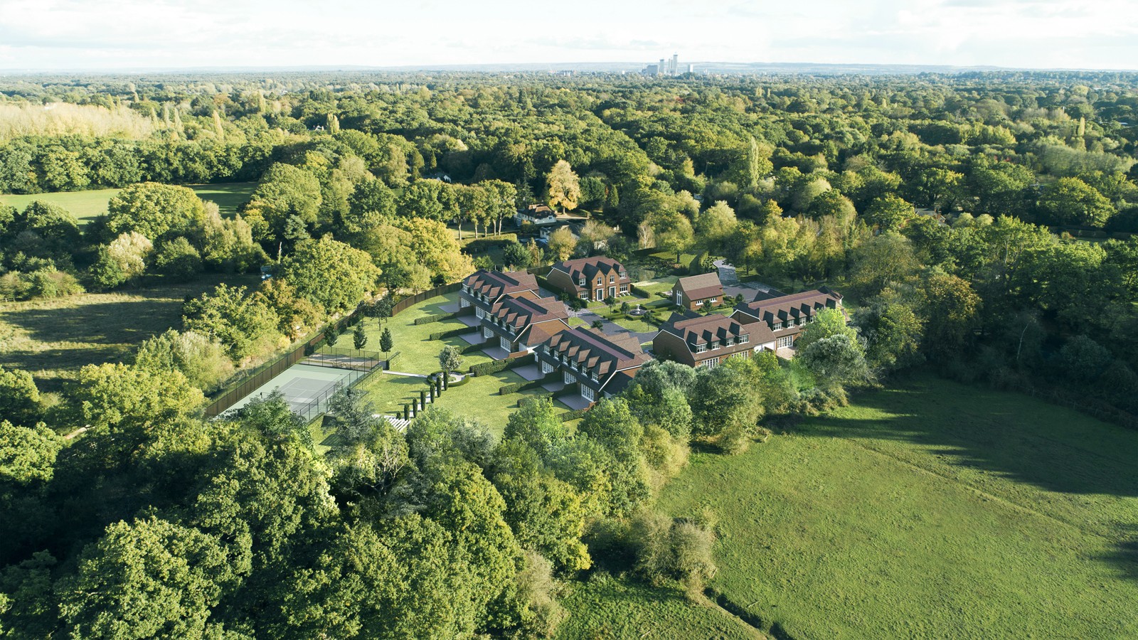 Aerial visualisation of the development set within its mature woodland landscape