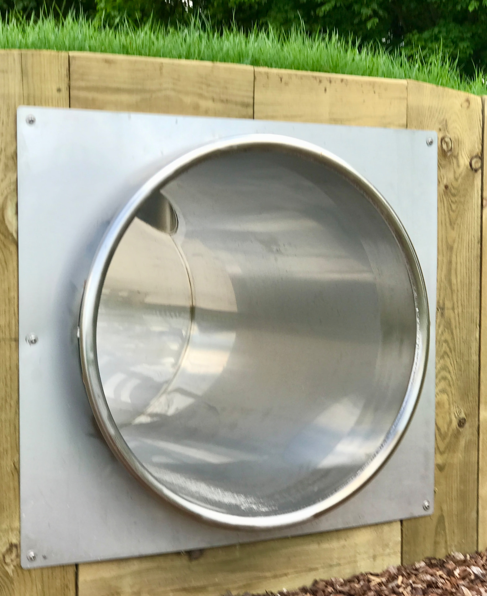 Stainless-steel circular play tunnel at Newmarket Racecourse Family Enclosure