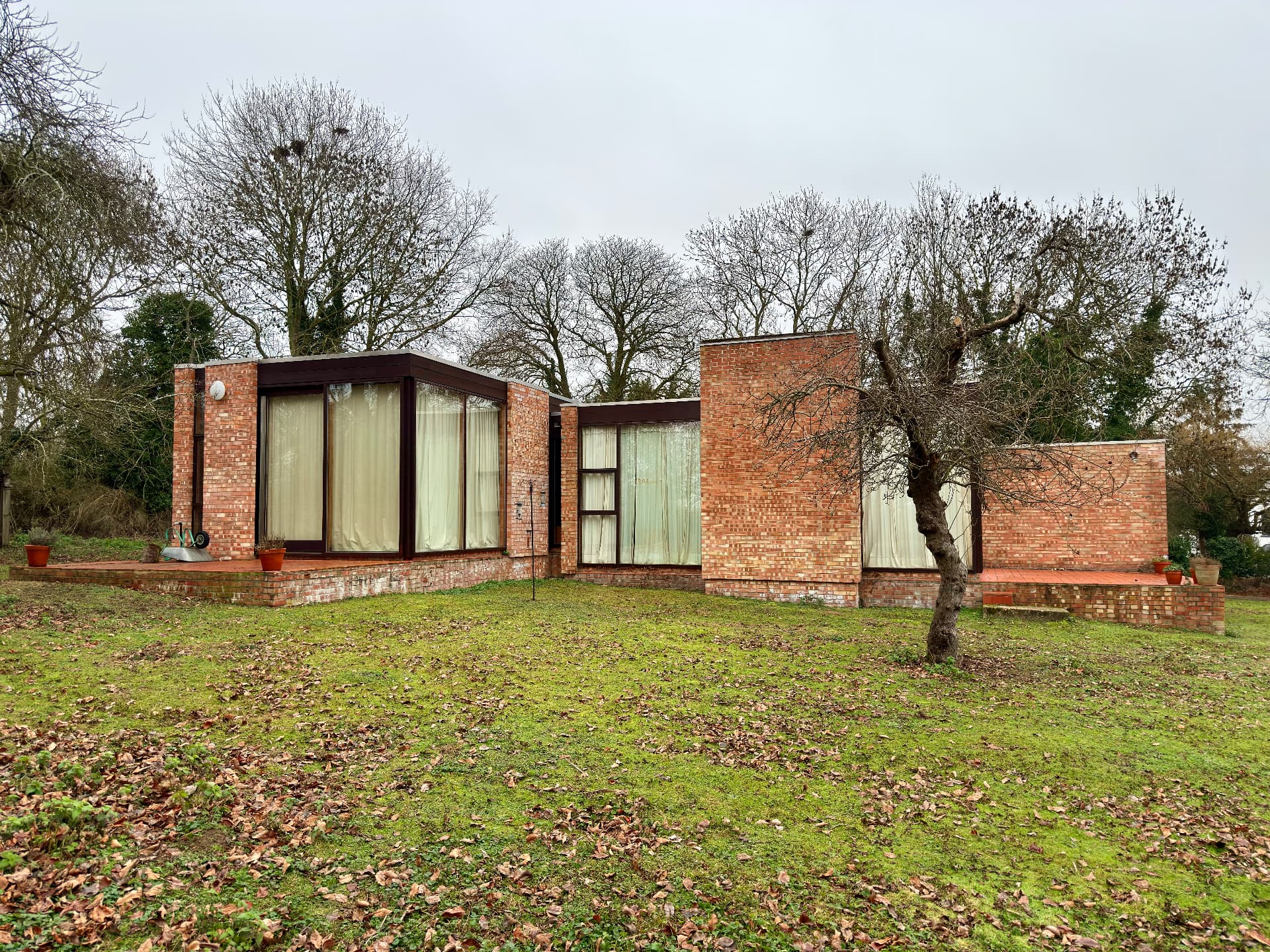 The house within the orchard in winter